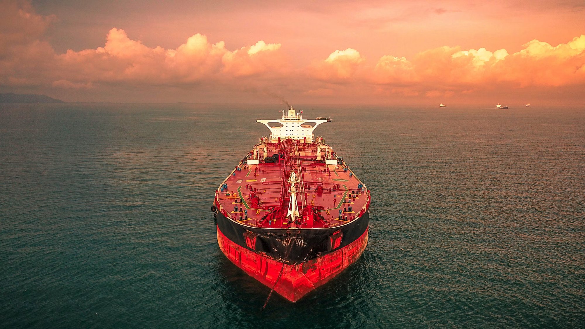 Crude oil tanker at anchor at sunset